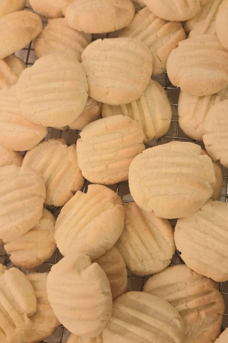 Sandnøtter — Norwegian Christmas butter cookies with the classic fork pattern, dusted pale and golden
