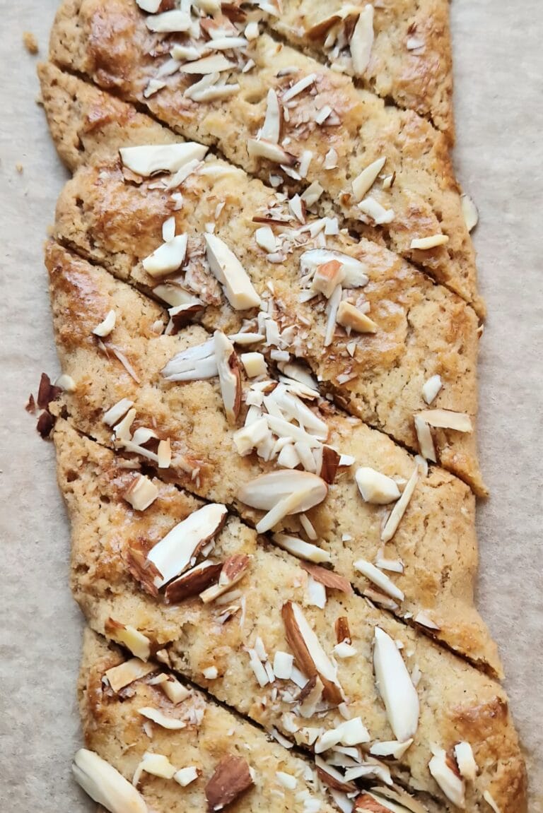 Brune pinner — thin diagonal Norwegian Christmas cookies topped with chopped almonds and sugar