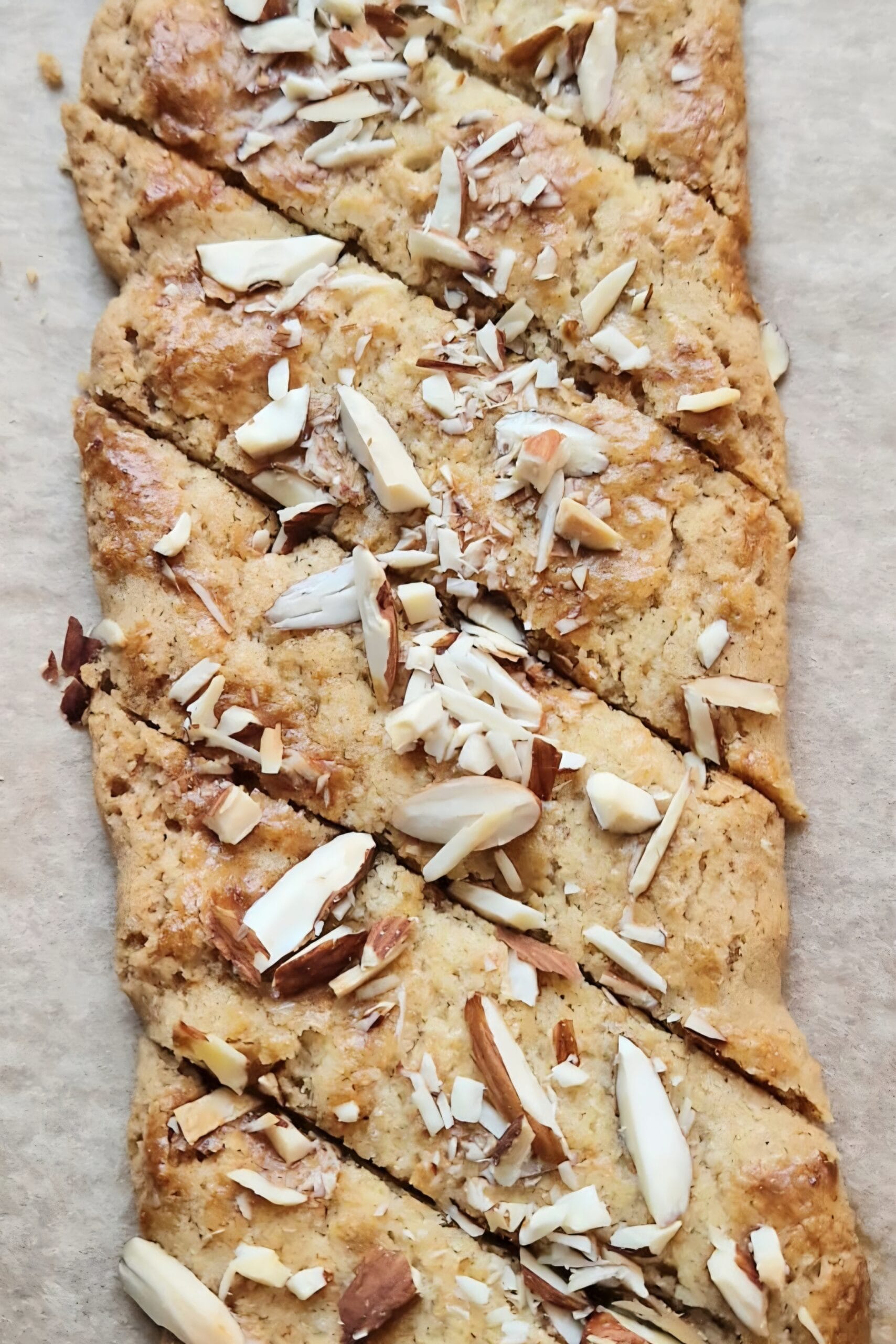 Brune pinner — thin diagonal Norwegian Christmas cookies topped with chopped almonds and sugar