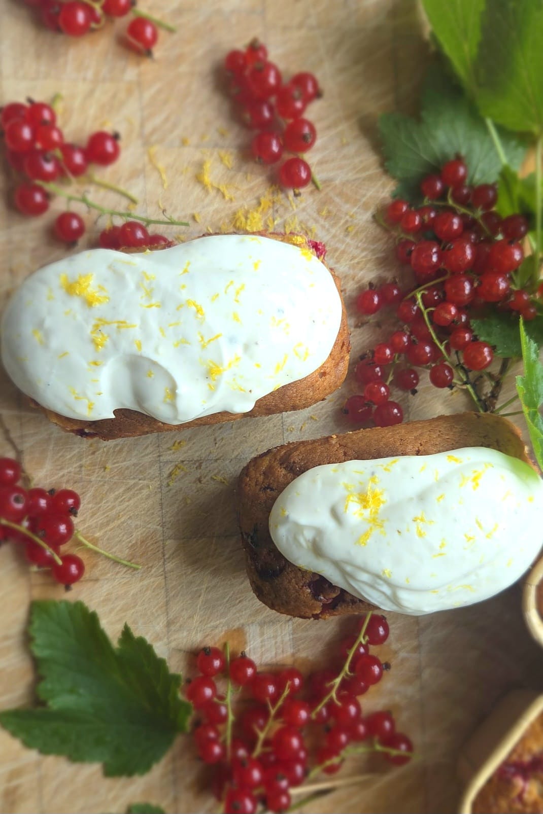Sourdough discard mini loaves with redcurrants and lemon vanilla Greek yogurt glaze in paper molds