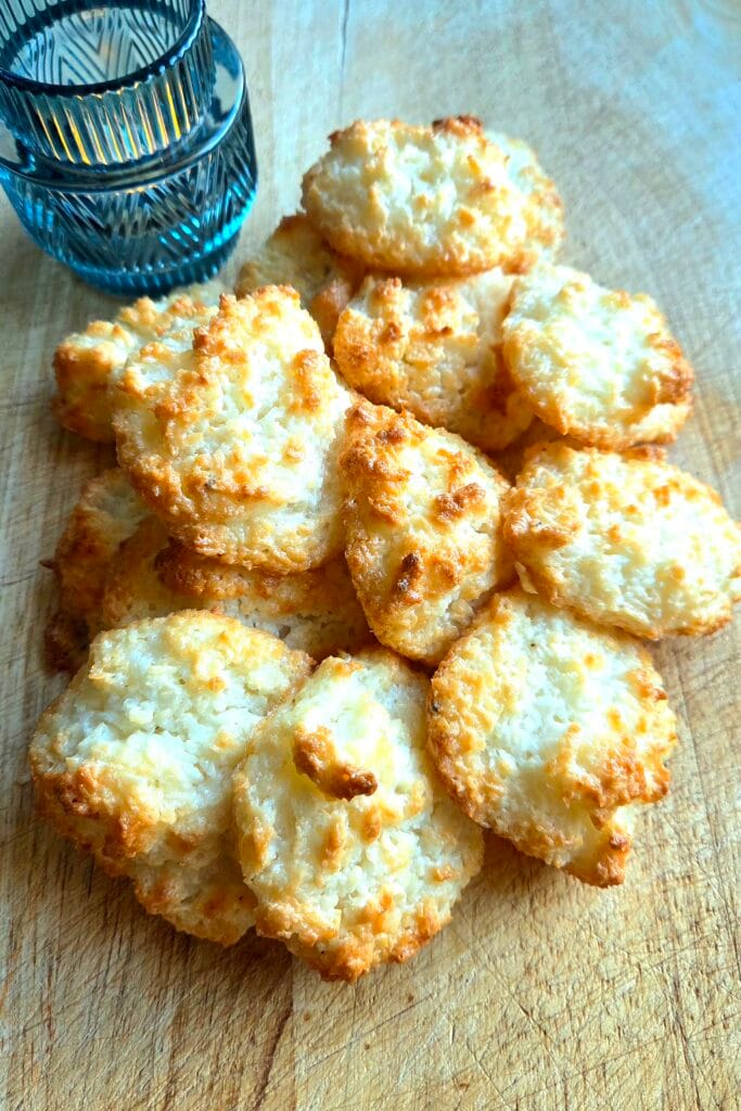 Close-up of a Norwegian coconut macaroon showing the crisp golden shell and ruffled coconut edges