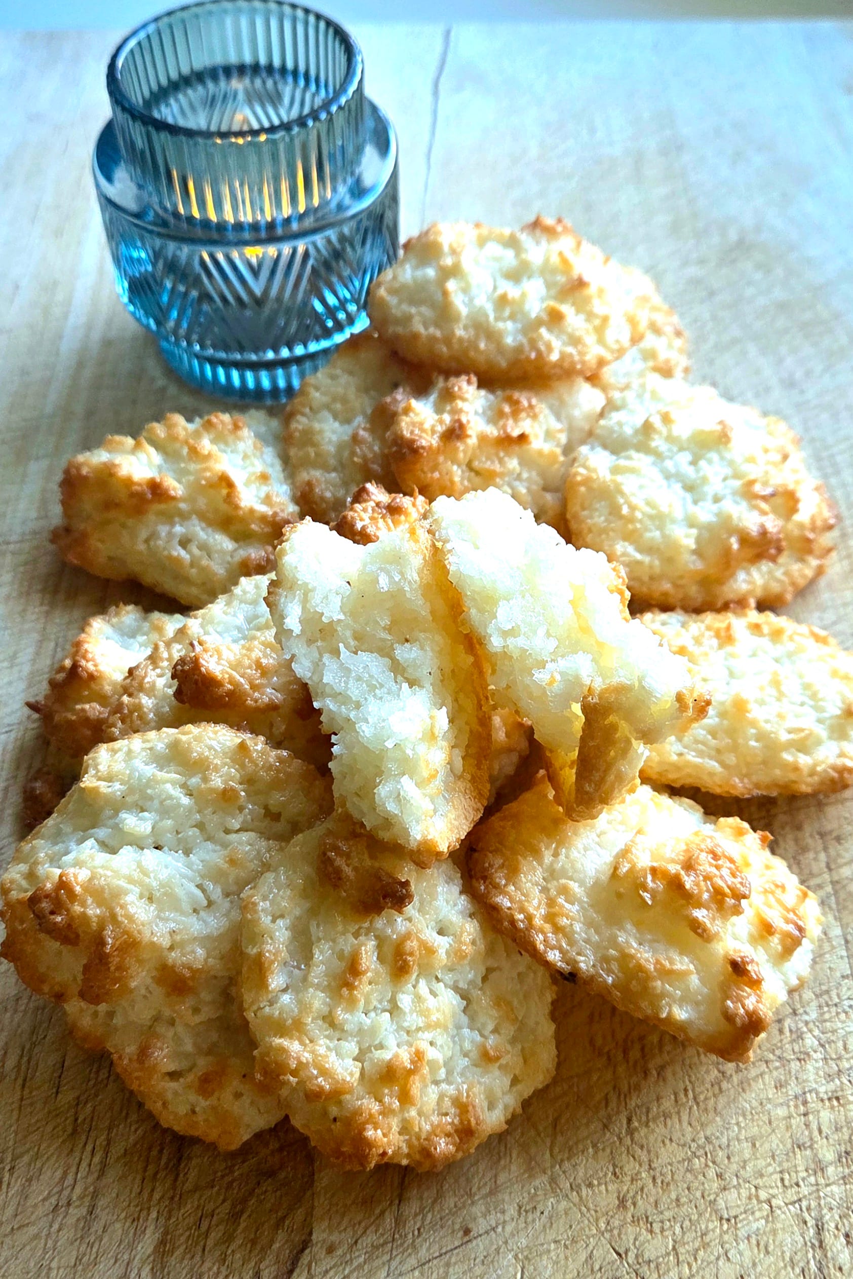 Golden Norwegian coconut macaroons, kokosmakroner, on a wooden board