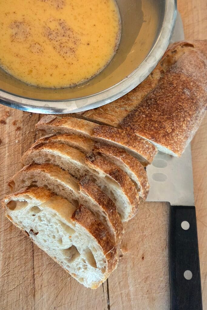 Cardamom custard and sliced sourdough ready for Norwegian French toast
