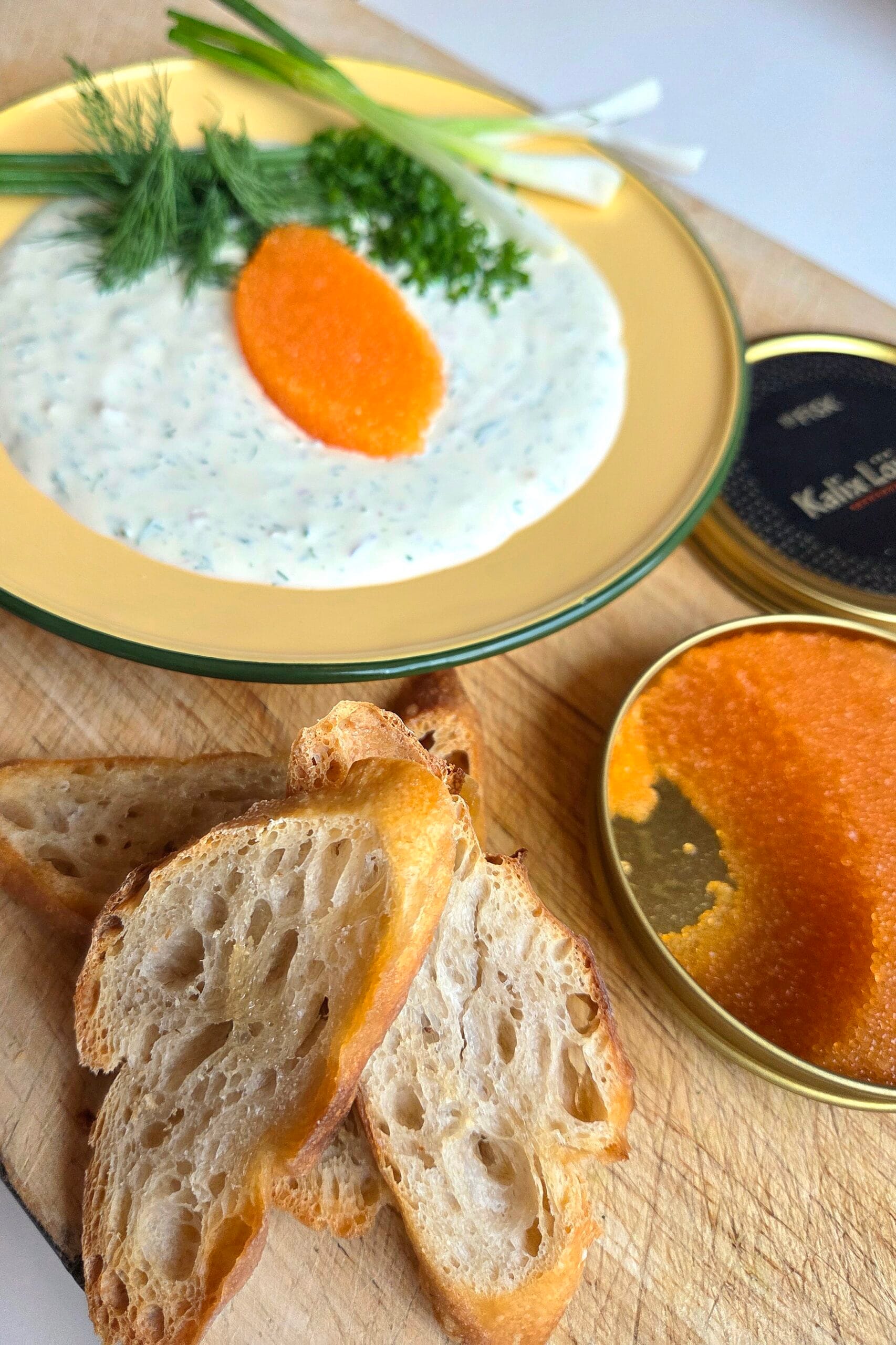 Caviar dip with dill sour cream and crisp sourdough chips