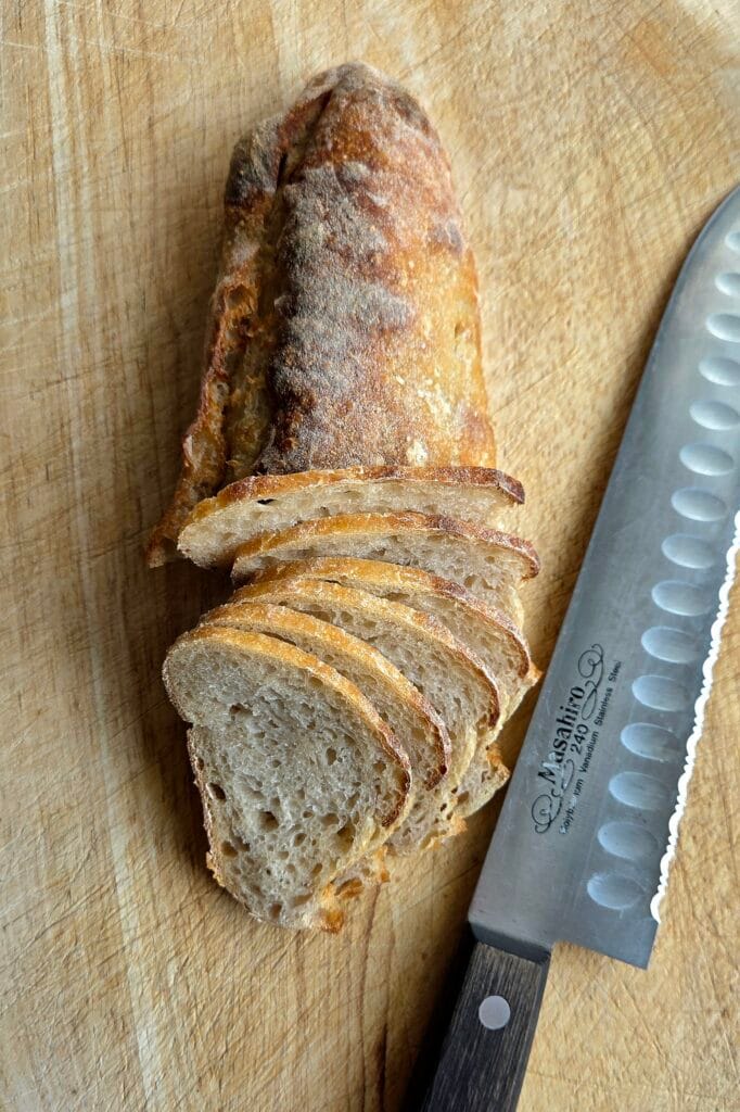 Leftover sourdough baguette sliced thin for bread chips