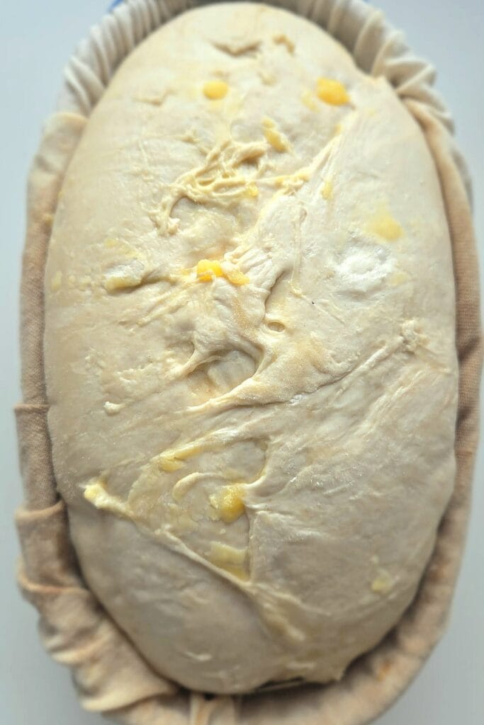 Grated brown butter folded through the dough before the final shape.