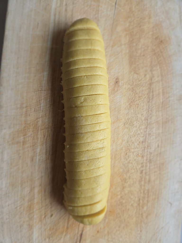 Serinakaker cookie dough log cut into even pieces