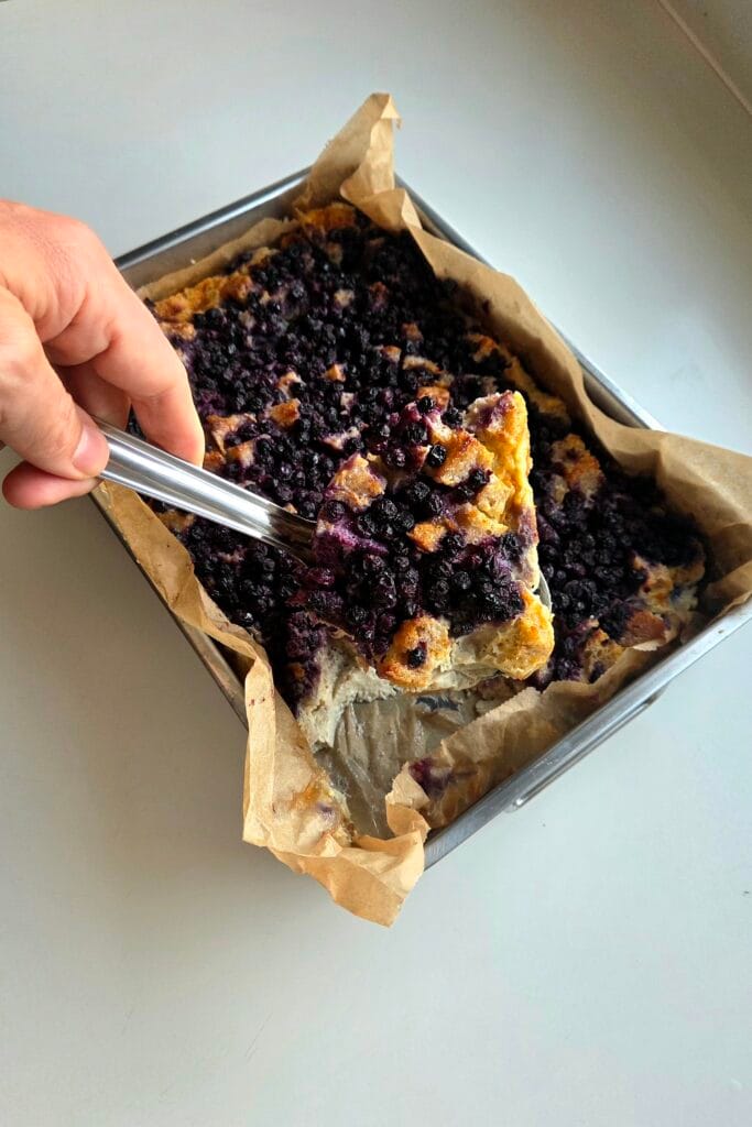 Sourdough bread pudding cut into squares in the pan, ready to serve