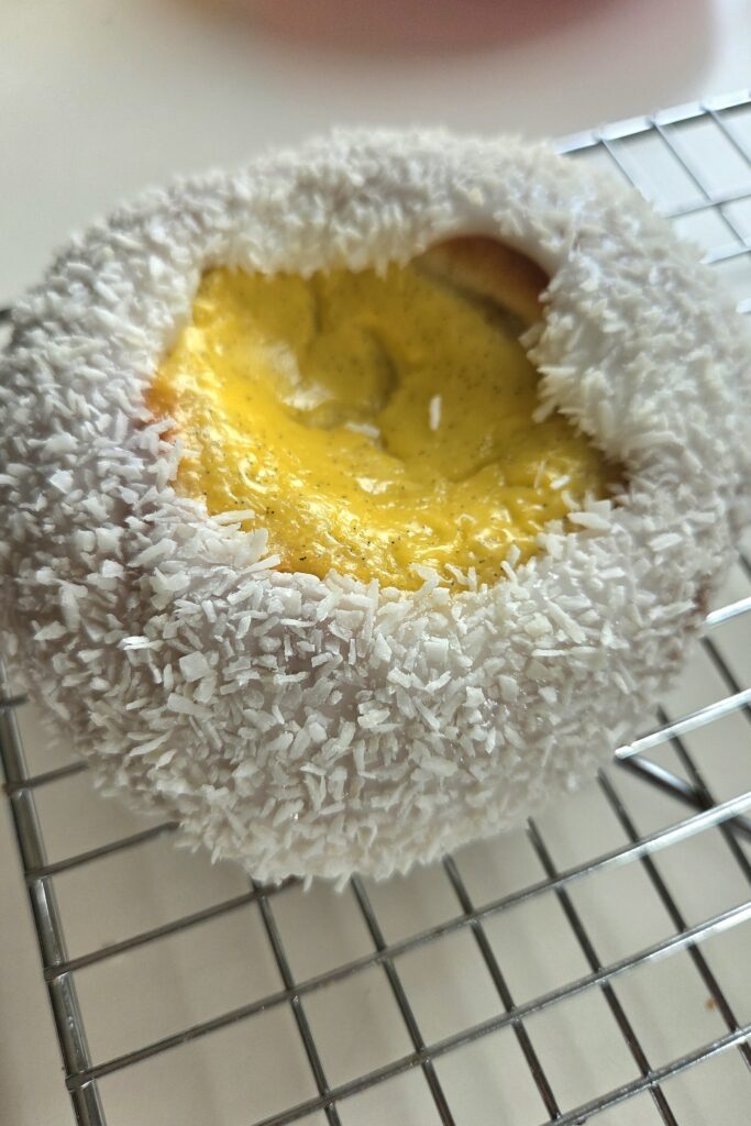 Skolebrød baked with conventional heat, the vanilla custard set glossy and contained in each well