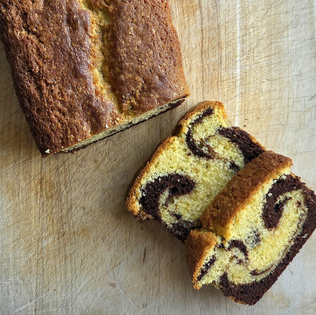 Close-up of a Norwegian marble cake slice showing the cocoa and vanilla swirl