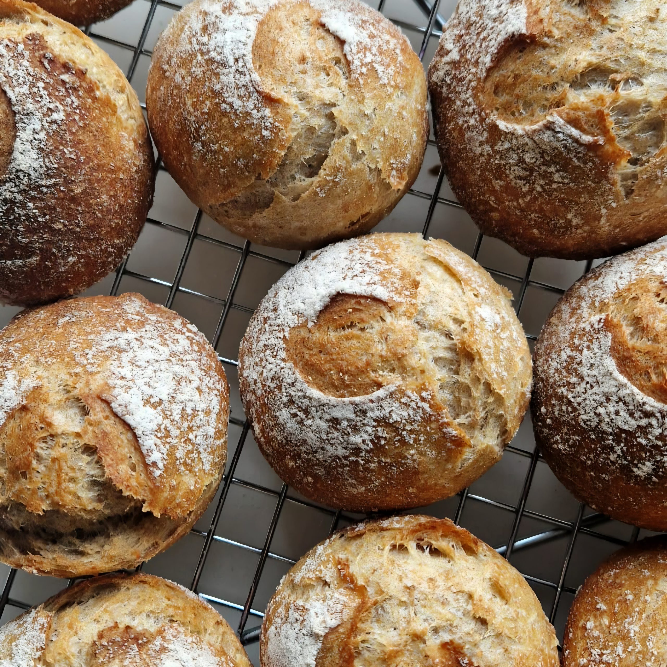 Crusty golden sourdough rolls, rustic and freshly baked