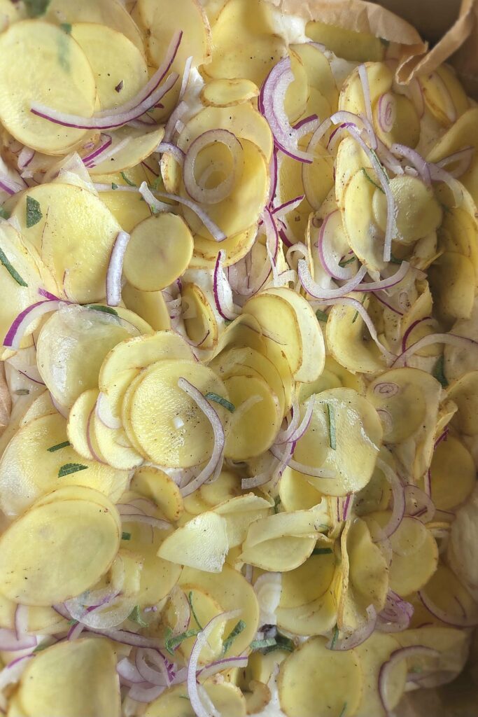 Paper-thin potato slices, red onion and sage layered over focaccia dough before baking